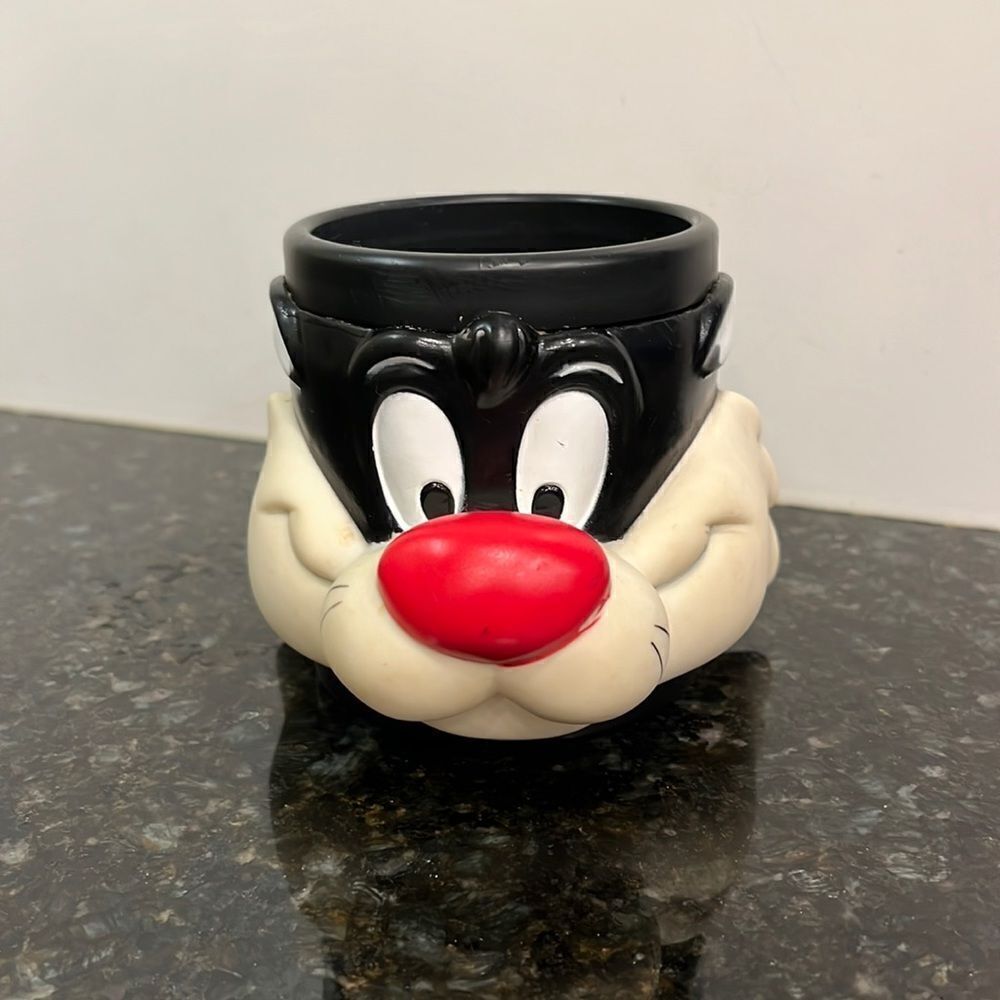 Warner Brothers Sylvester the Cat plastic character mug with handle.